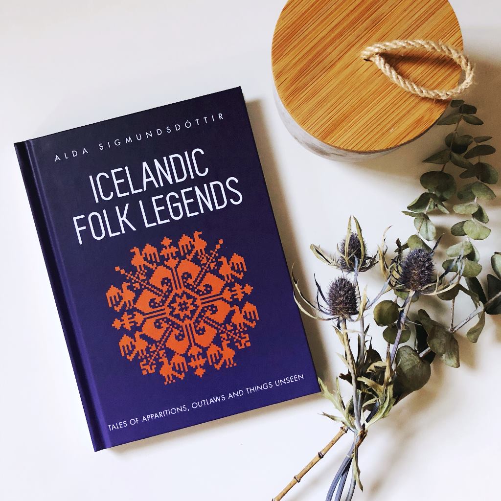 Hardcover copy of Icelandic Folk Legends on a white table with flowers