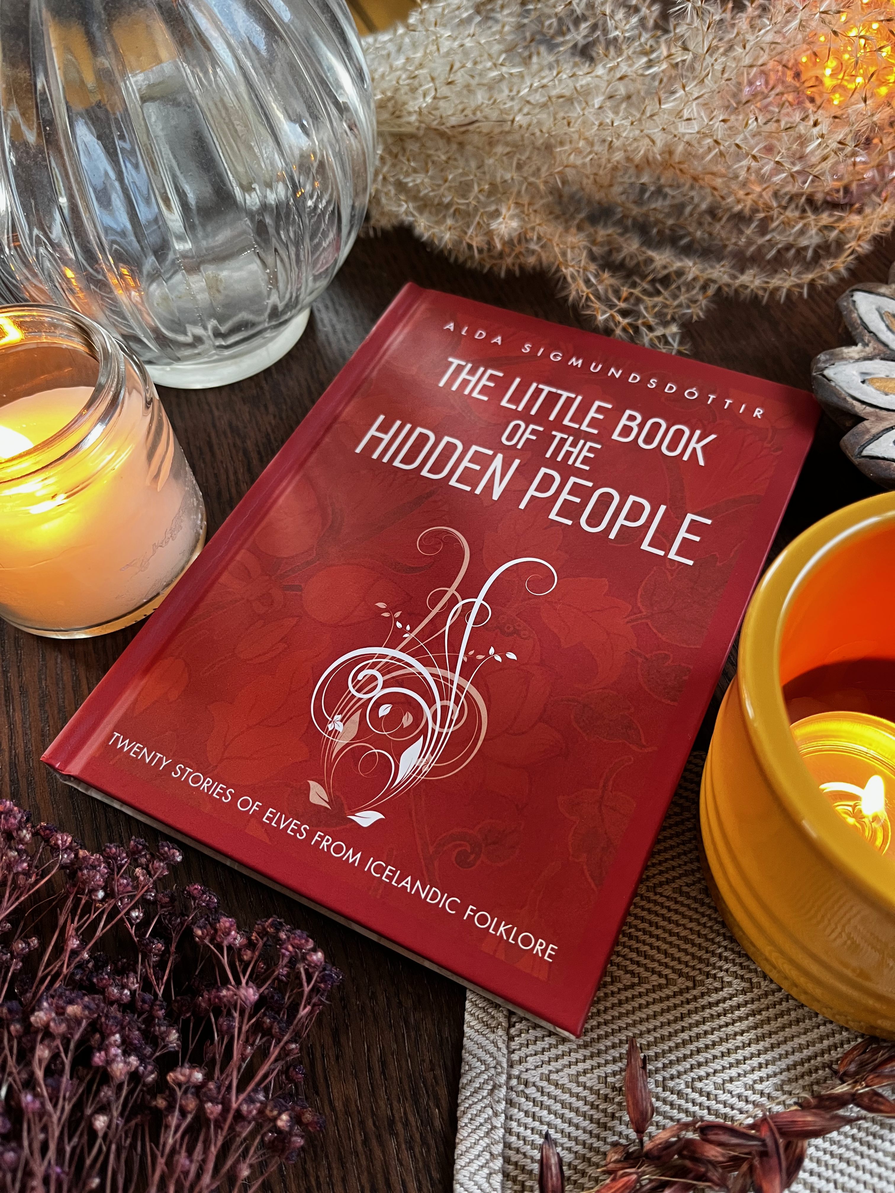 Hardcover copy of The Little Book of the Hidden People lying on a cloth